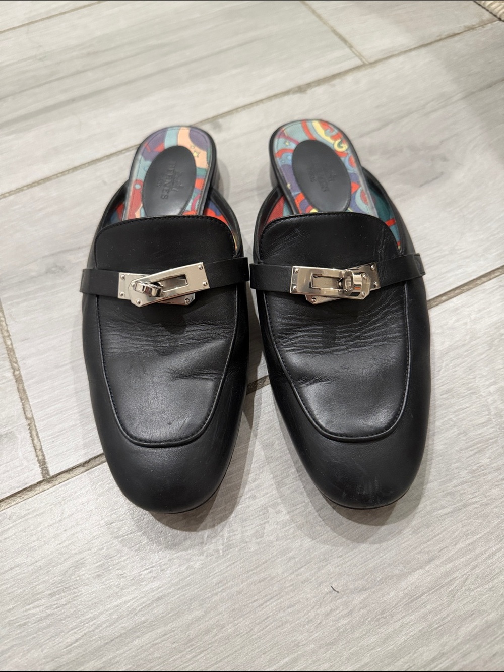Hermes Slip-On Mules with Silver Hardware has  sticker on kelly lock